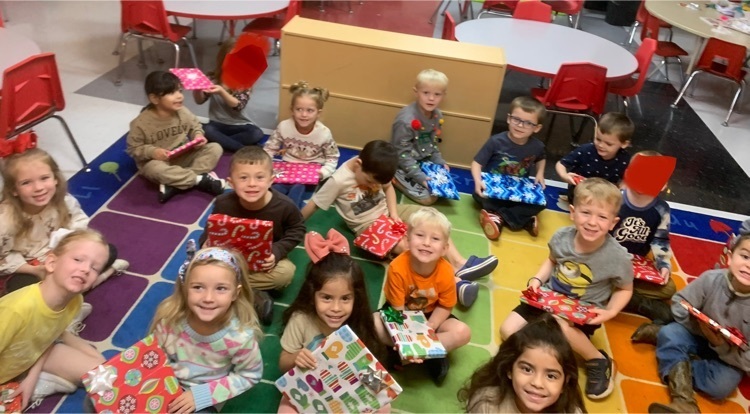 PreK students with their gifted books 